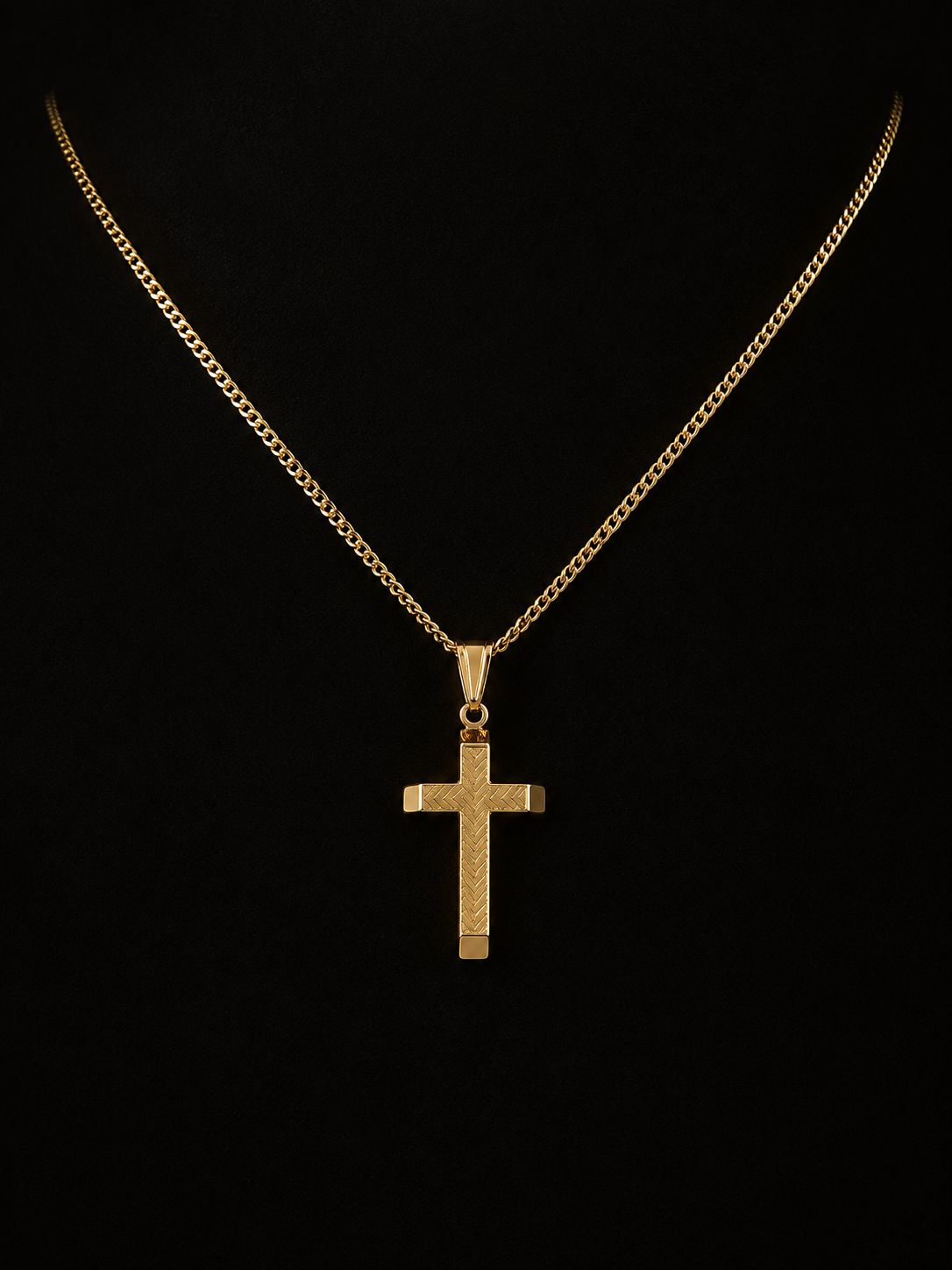 Solid gold engraved cross pendant on a curb chain