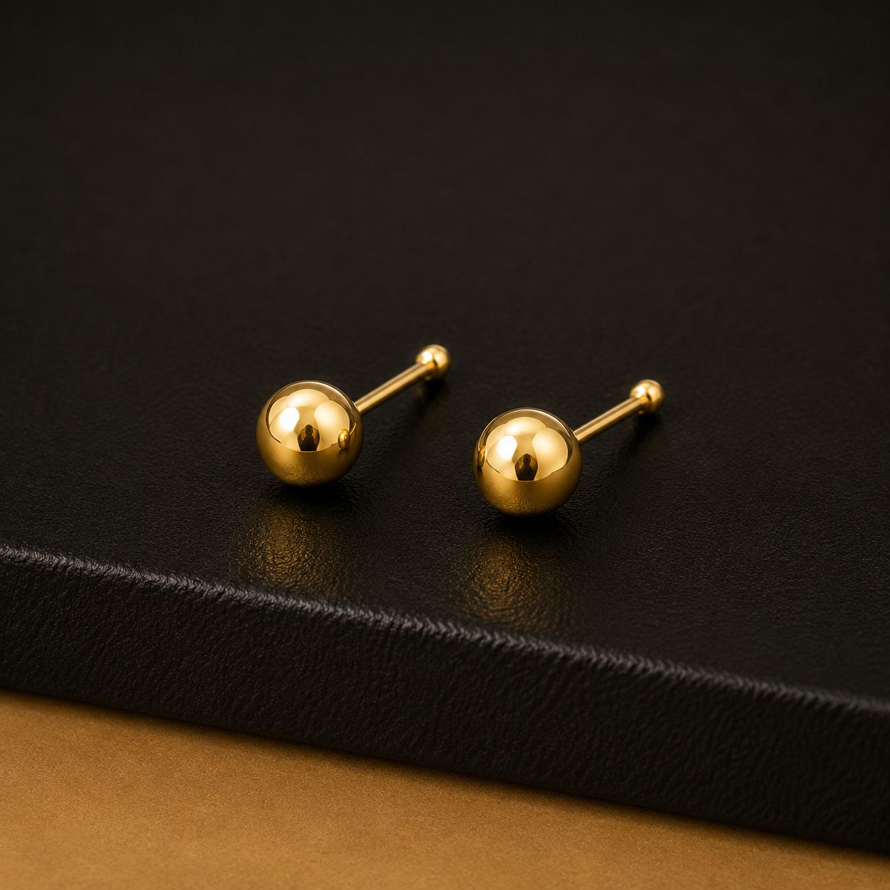 Polished solid gold ball stud earrings
