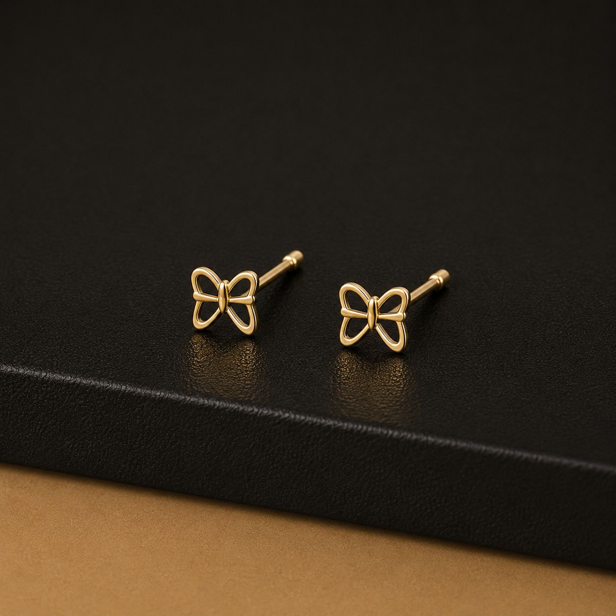 Open wire gold butterfly stud earrings