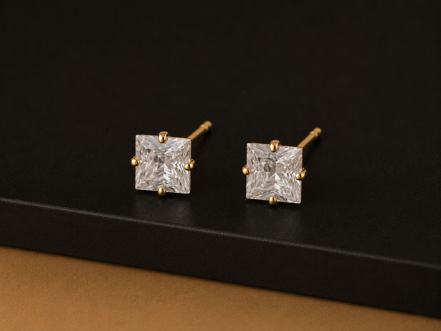 Gold stud earrings with square clear stones