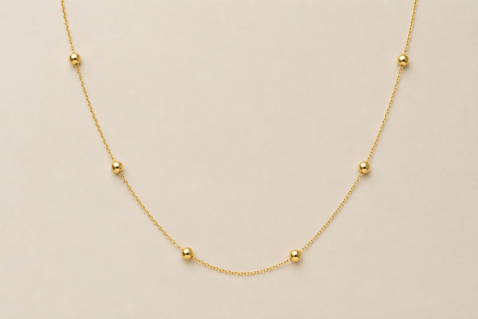 Solid 10K gold chain with six polished bead stations