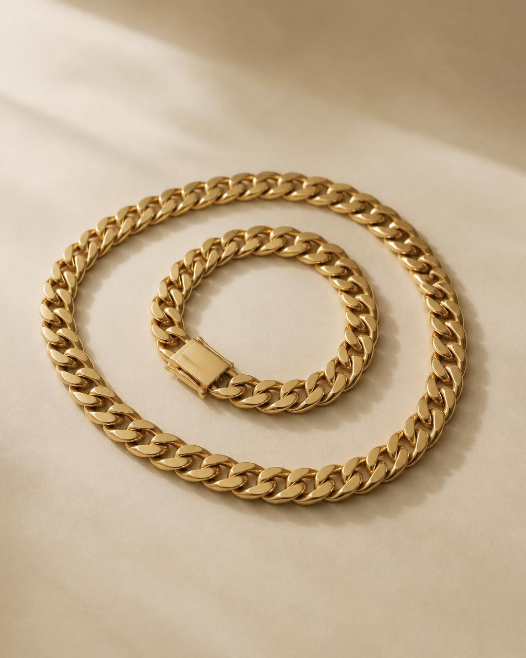 Polished solid gold Cuban link chain on a dark surface